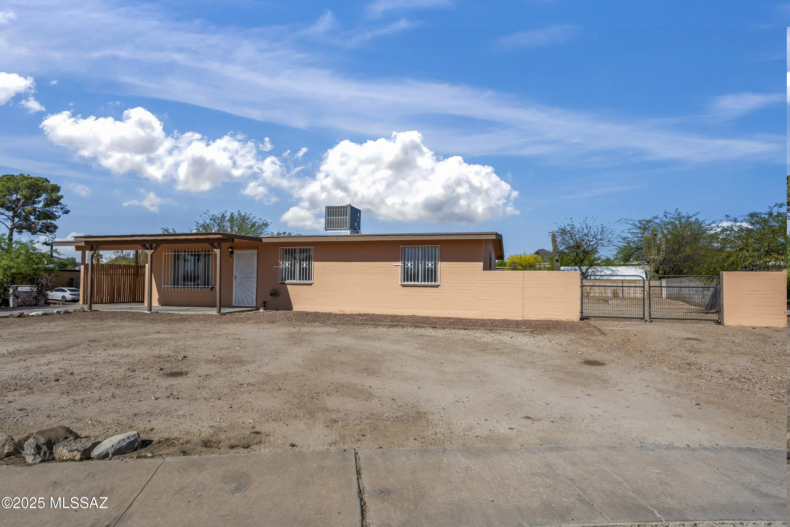 1926 West Saxony Road Tucson, AZ 85713 - Photo 2 of 26 a front view of a house with a yard and garage