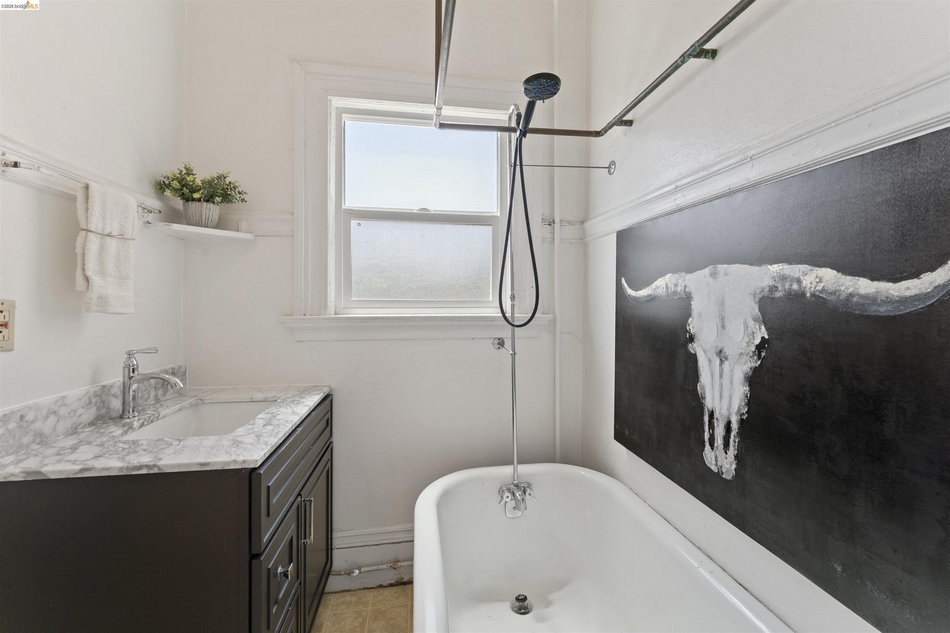 667 10th Street Oakland, CA 94607 - Photo 8 of 15 a bathroom with a sink and a bathtub