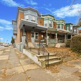 a view of a building with a bench in front of building