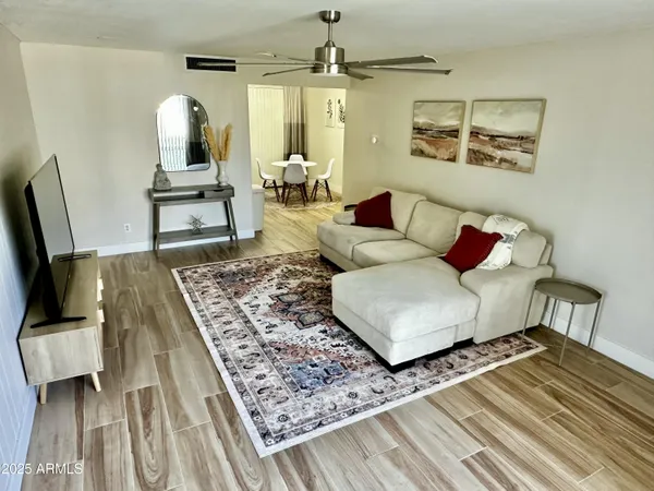 a living room with furniture and a rug