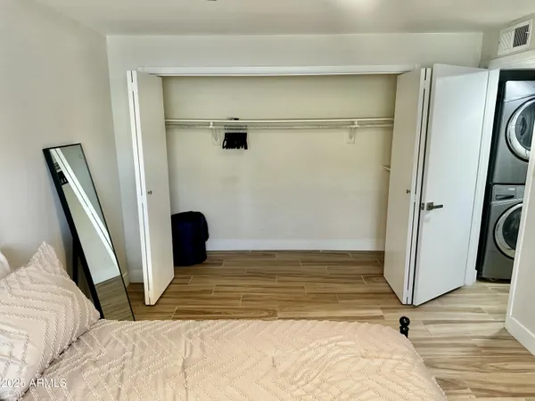 a view of a room with wooden floor and chair