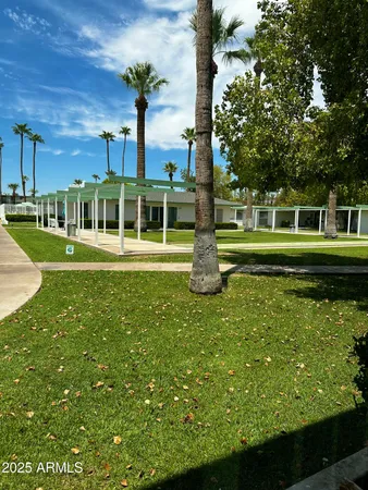 a front view of a house with a yard table and chairs