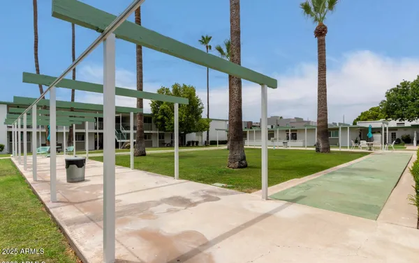 a view of a house with backyard and porch