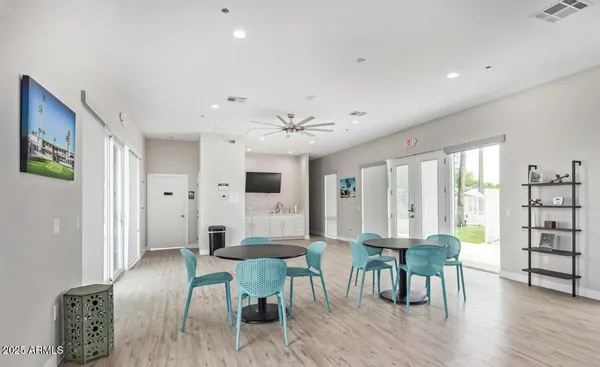 a view of a dining room with furniture and wooden floor
