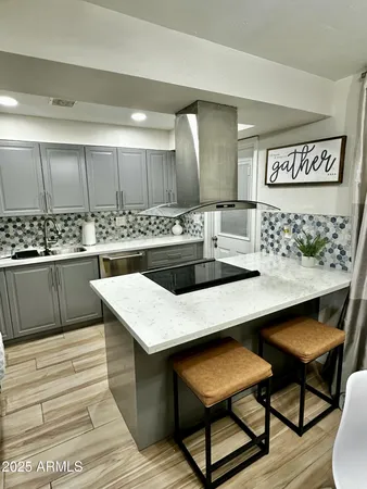 a kitchen with a table and chairs in it