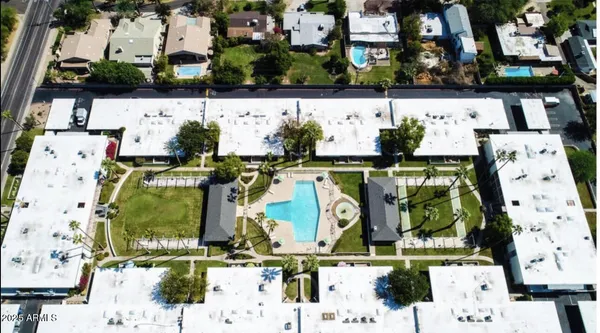 an aerial view of residential houses with outdoor space