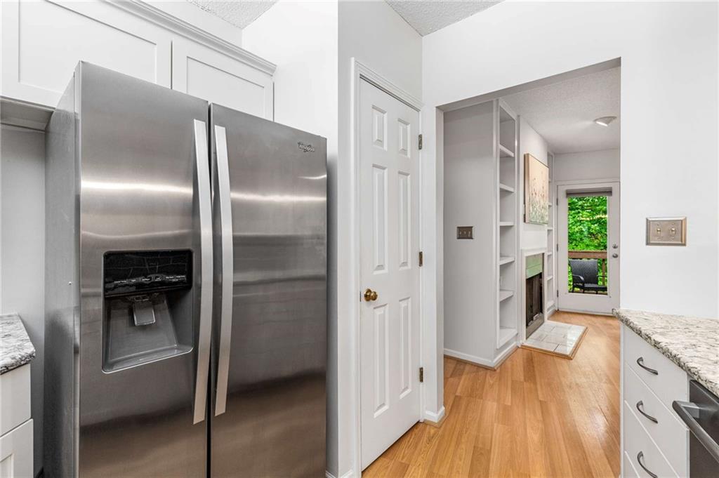 490 Sherman Way Decatur, GA 30033 - Photo 14 of 44 a kitchen with stainless steel appliances granite countertop a refrigerator and a sink
