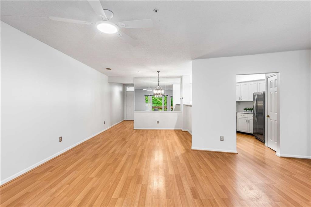490 Sherman Way Decatur, GA 30033 - Photo 19 of 44 wooden floor in an empty room with a window