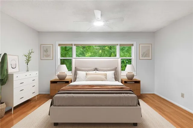 a bedroom with bed and window