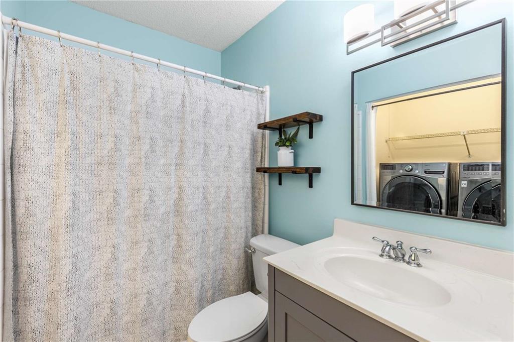 490 Sherman Way Decatur, GA 30033 - Photo 35 of 44 a bathroom with a sink and a mirror