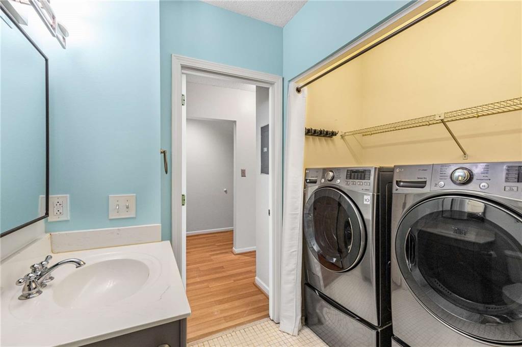 490 Sherman Way Decatur, GA 30033 - Photo 37 of 44 a utility room with sink dryer and washer