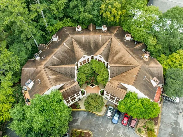 an aerial view of a house with an outdoor space