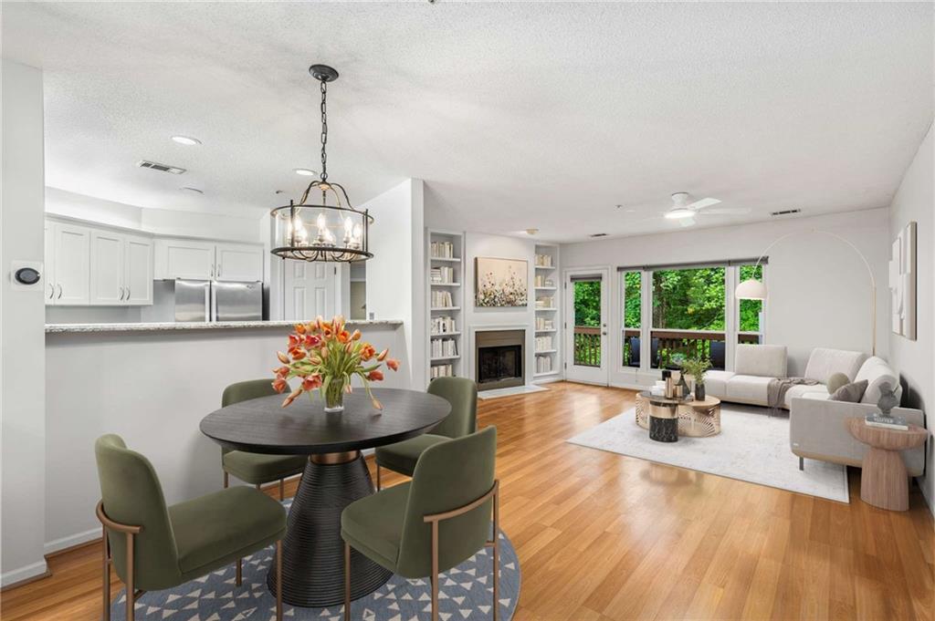 490 Sherman Way Decatur, GA 30033 - Photo 8 of 44 a living room with fireplace furniture and a large window