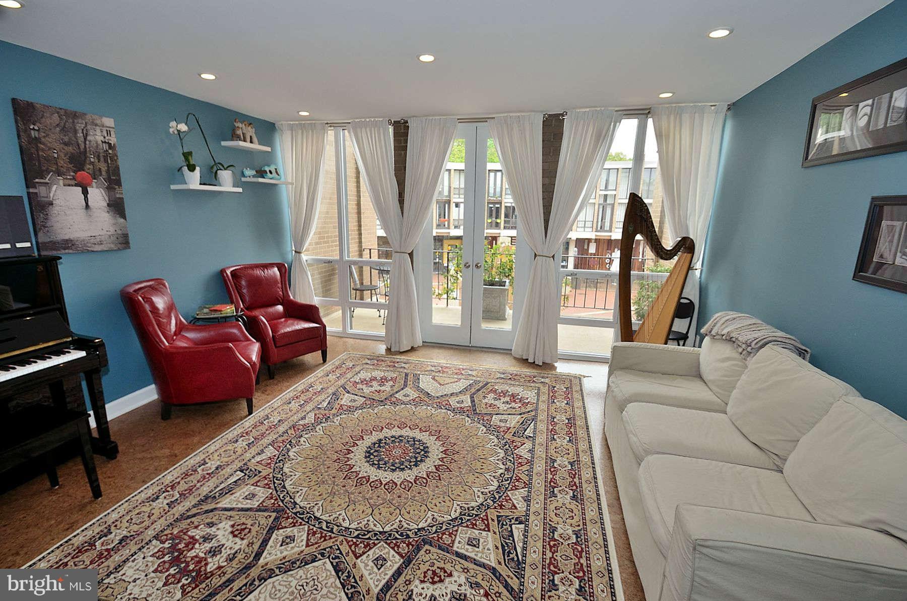 1628 Chimney House Road, Unit 1628 Reston, VA 20190 - Photo 11 of 13 a living room with furniture and a wooden floor