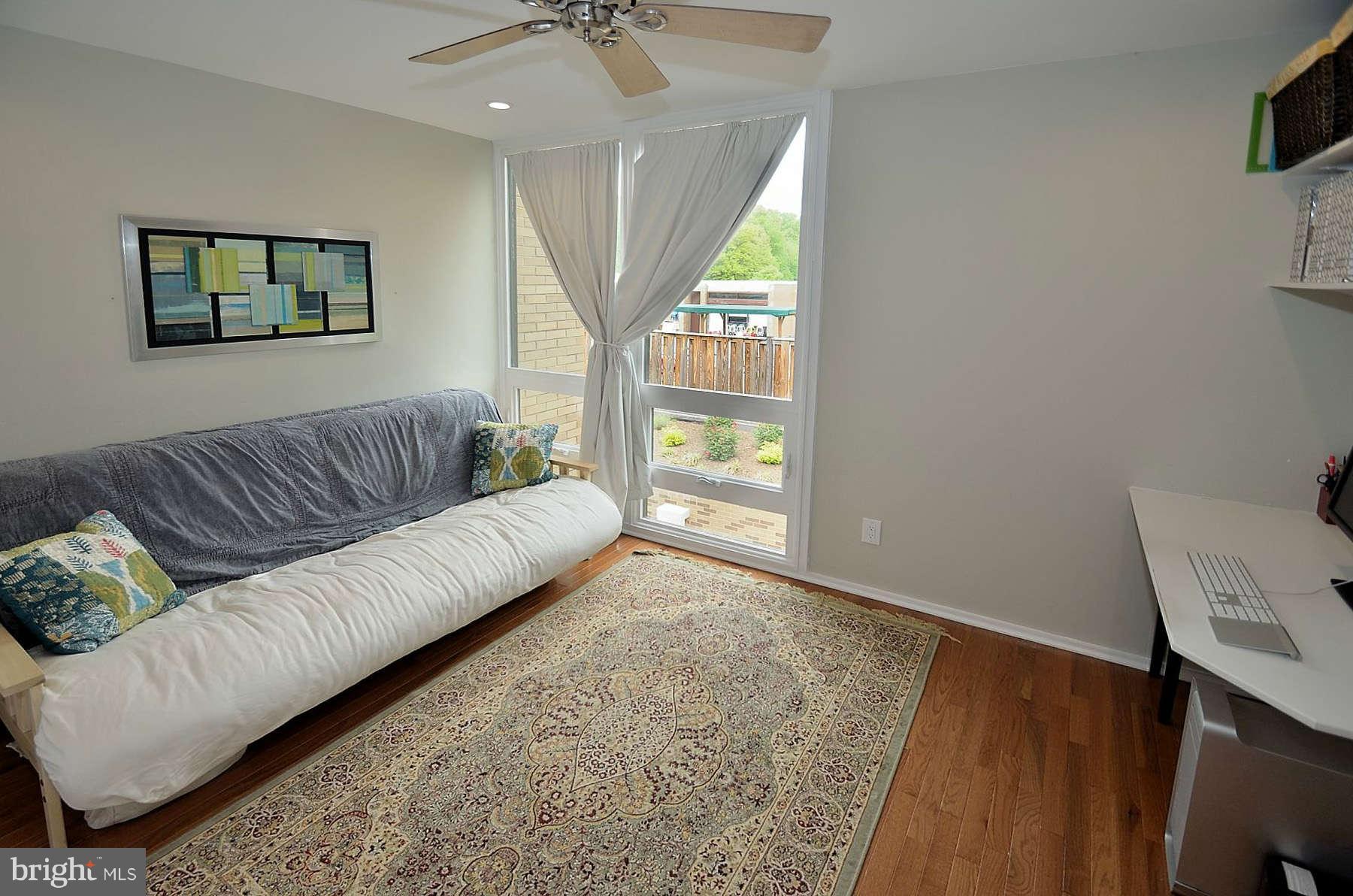 1628 Chimney House Road, Unit 1628 Reston, VA 20190 - Photo 12 of 13 a living room with furniture and a large window