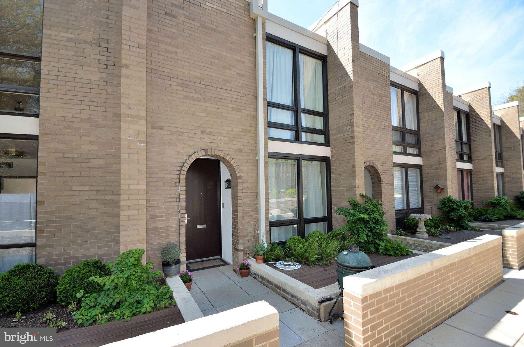 1628 Chimney House Road, Unit 1628 Reston, VA 20190 - Photo 3 of 13 a front view of a house with garden