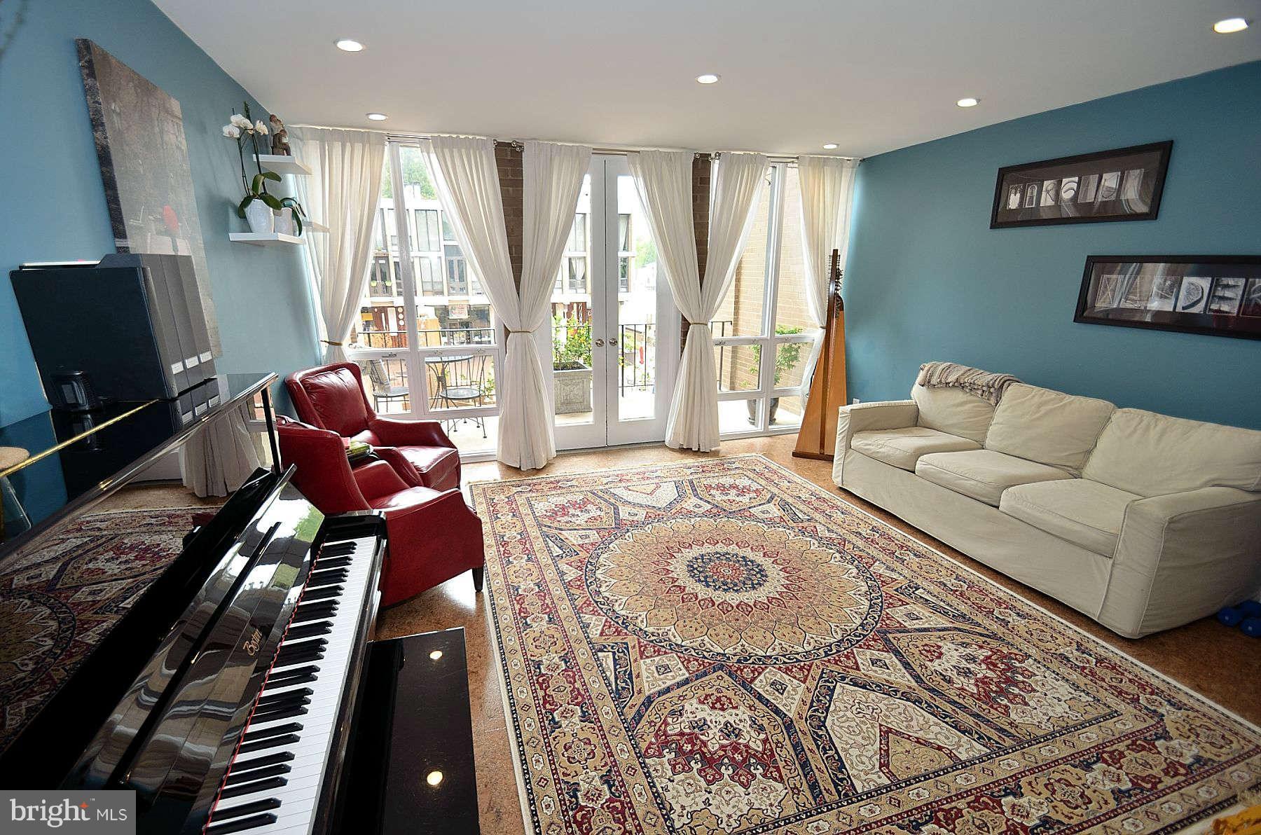 1628 Chimney House Road, Unit 1628 Reston, VA 20190 - Photo 4 of 13 a living room with furniture and a flat screen tv