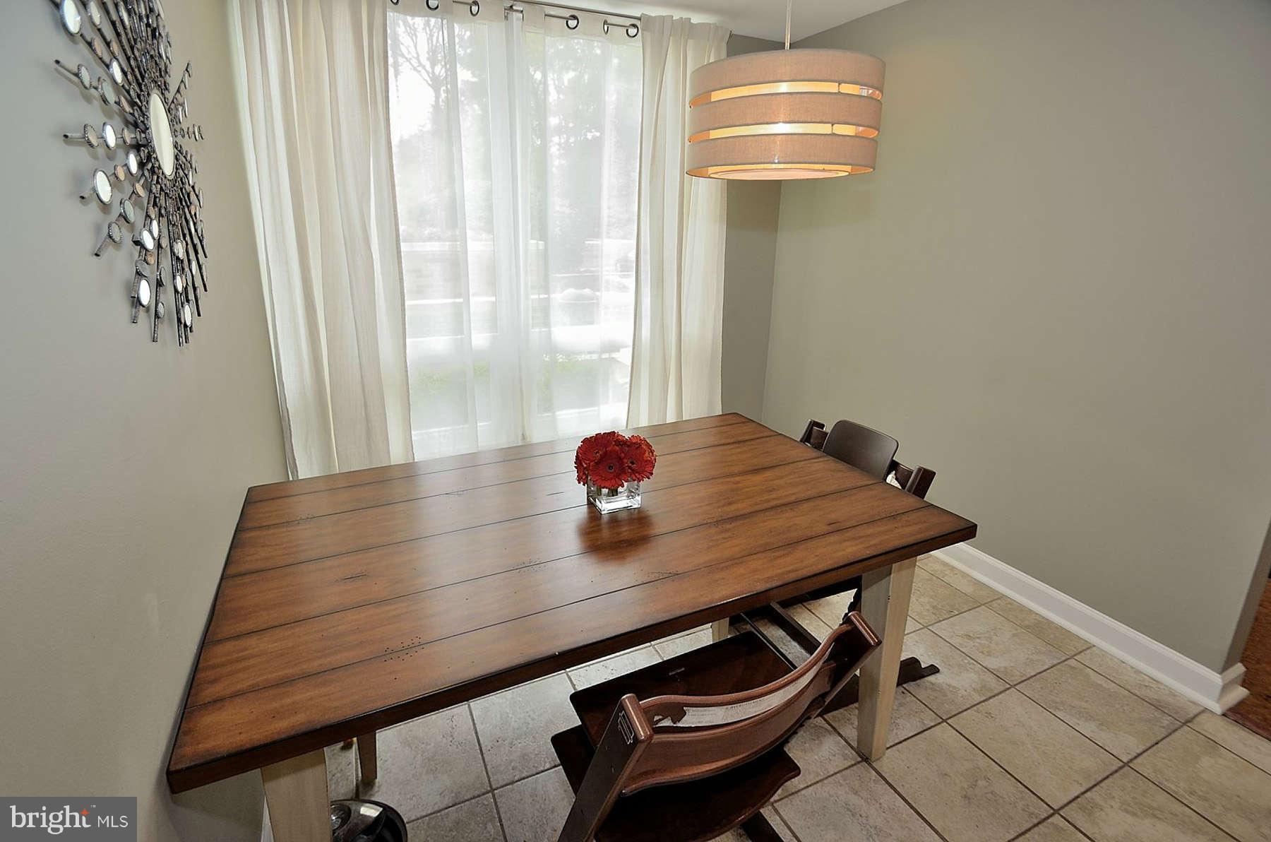 1628 Chimney House Road, Unit 1628 Reston, VA 20190 - Photo 7 of 13 a view of a room with a table and chairs