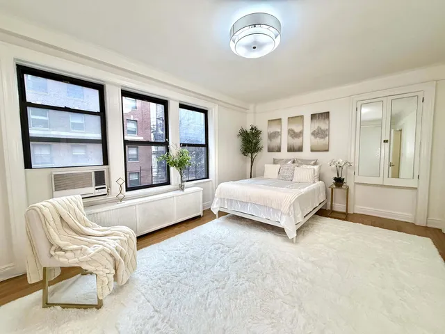 a view of a living room with a large window
