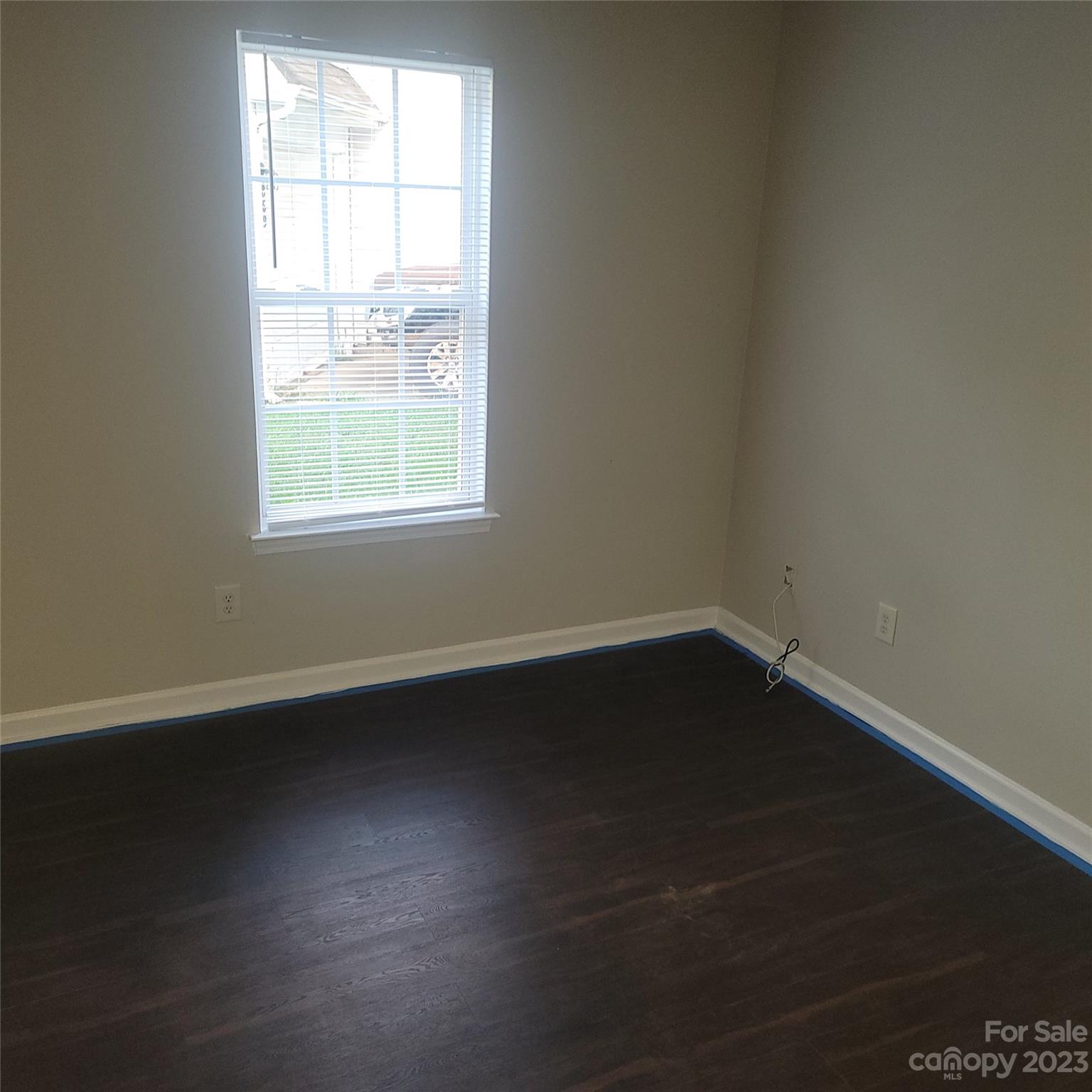 2865 Oasis Lane Charlotte, NC 28214 - Photo 11 of 15 an empty room with wooden floor and windows