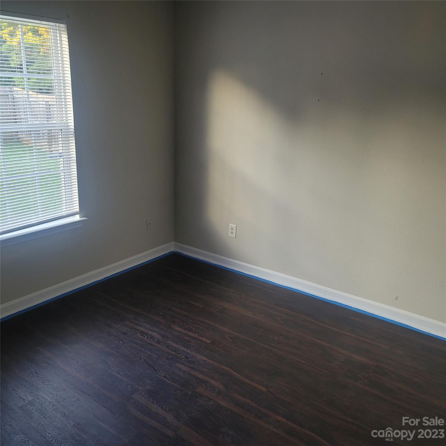 2865 Oasis Lane Charlotte, NC 28214 - Photo 12 of 15 an empty room with wooden floor and windows