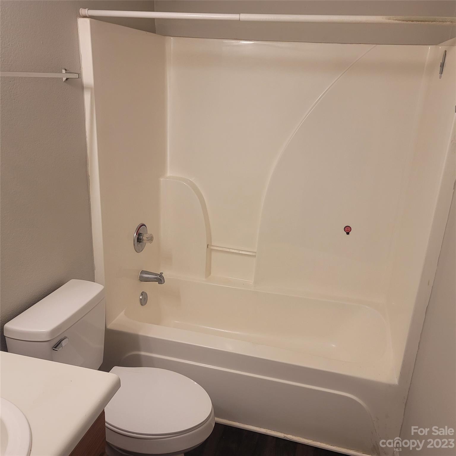 2865 Oasis Lane Charlotte, NC 28214 - Photo 13 of 15 a bathroom with a toilet and a bathtub