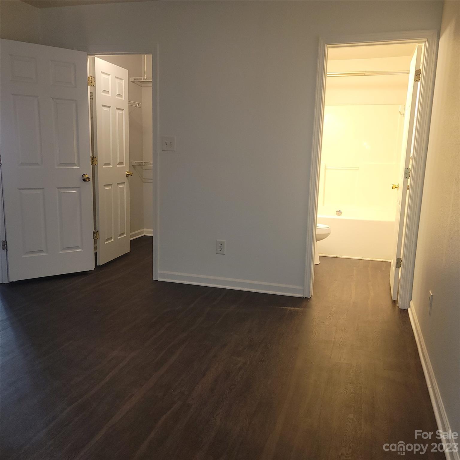 2865 Oasis Lane Charlotte, NC 28214 - Photo 8 of 15 an empty room with wooden floor and windows