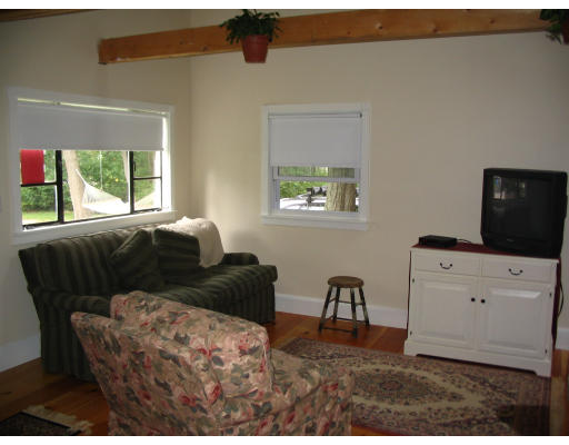 38 Hatherly Road Scituate, MA 02066 - Photo 2 of 10 a living room with furniture and a flat screen tv
