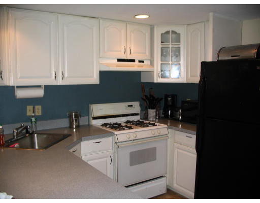 38 Hatherly Road Scituate, MA 02066 - Photo 5 of 10 a kitchen with granite countertop a stove a sink dishwasher and a refrigerator