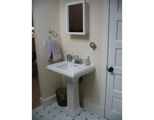 38 Hatherly Road Scituate, MA 02066 - Photo 7 of 10 a bathroom with a sink and a mirror
