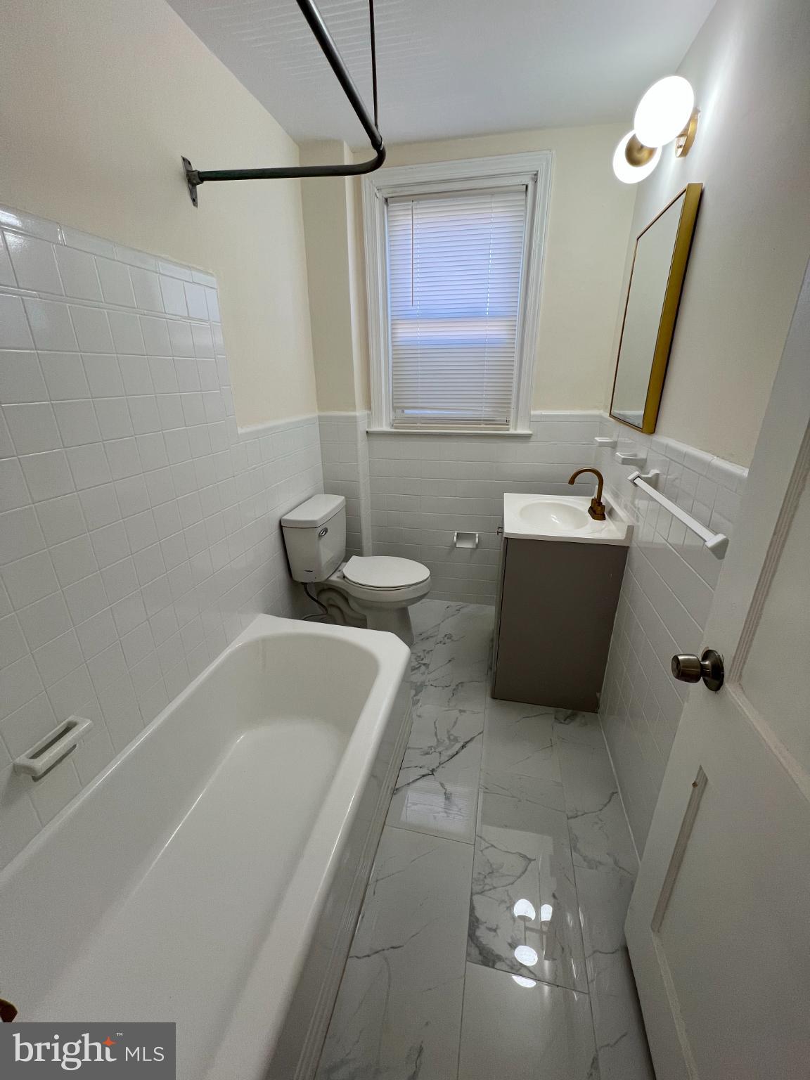 4345 Loring Street Philadelphia, PA 19136 - Photo 7 of 16 a bathroom with a tub a rug and a shower