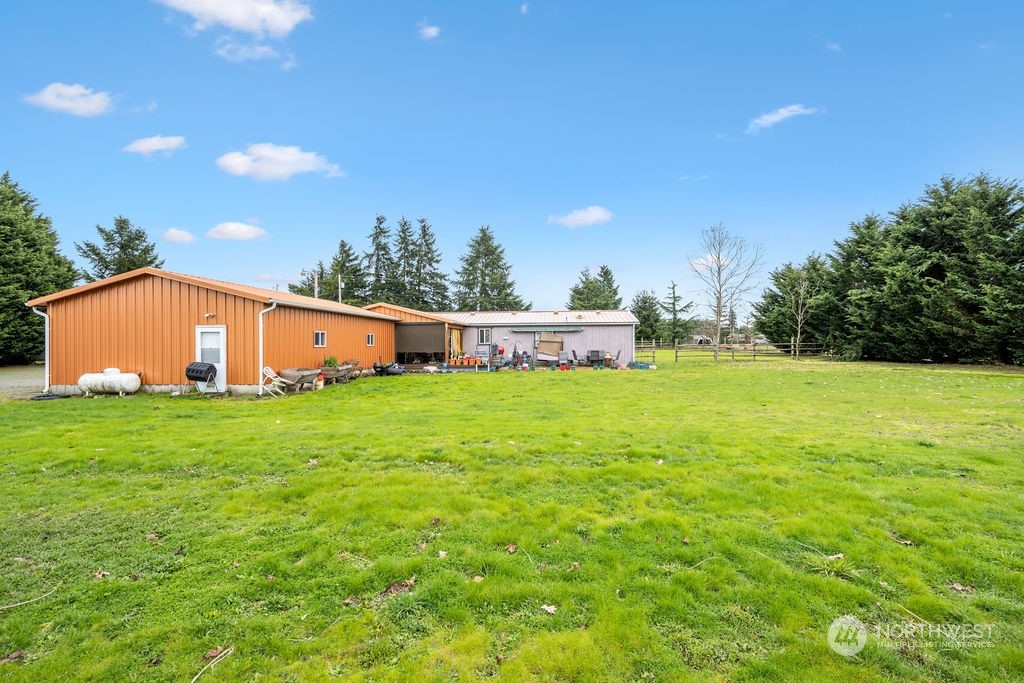 17043 Leitner Road Southwest Rochester, WA 98579 - Photo 14 of 18 a view of an house with backyard space and balcony