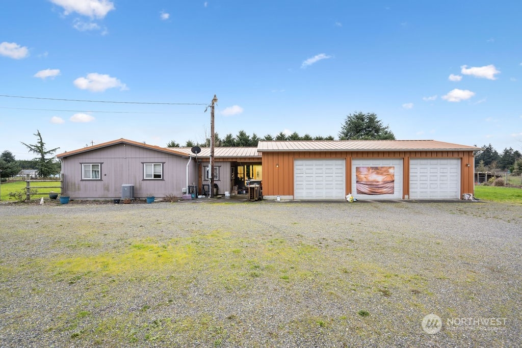 17043 Leitner Road Southwest Rochester, WA 98579 - Photo 17 of 18 a front view of a house with a yard and garage