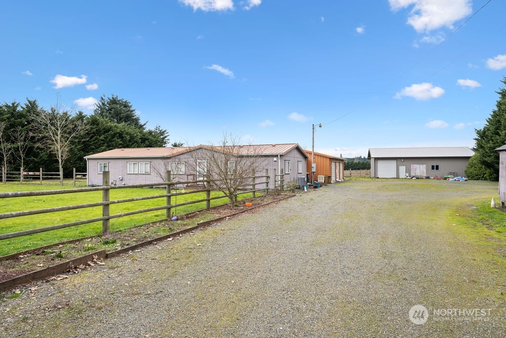 17043 Leitner Road Southwest Rochester, WA 98579 - Photo 2 of 18 a view of a house with a yard