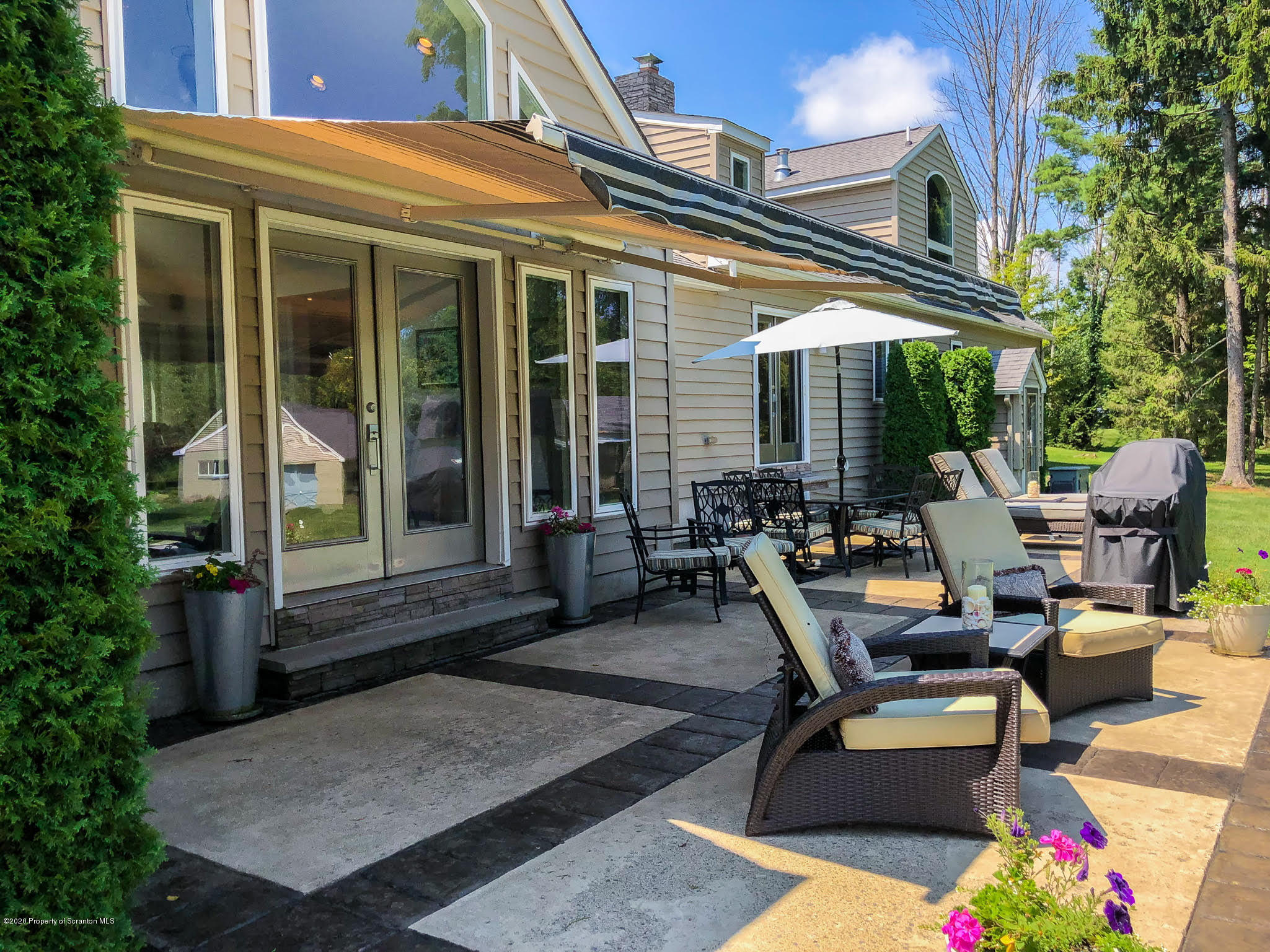 1164 Old Trail Road Clarks Summit, PA 18411 - Photo 26 of 36 patio with retractable awning