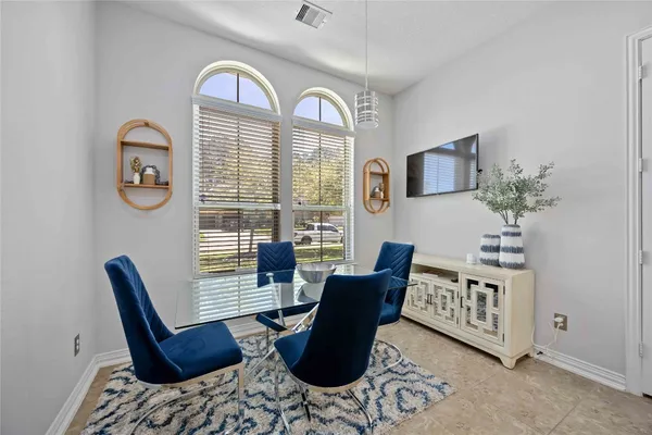 a view of a livingroom with furniture and a window