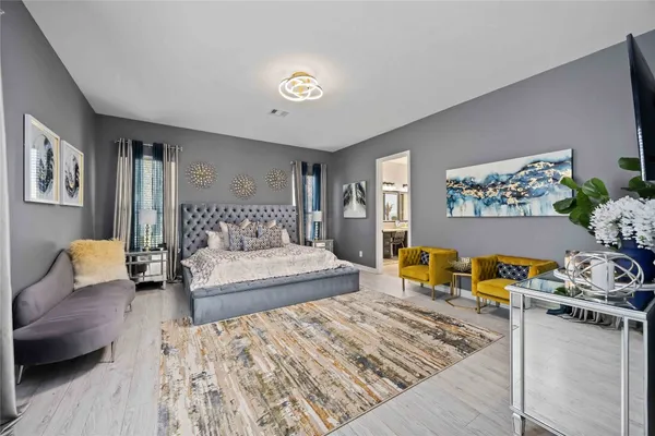 a bedroom with furniture and a couch