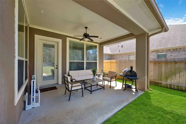 a dining room with furniture and a garden