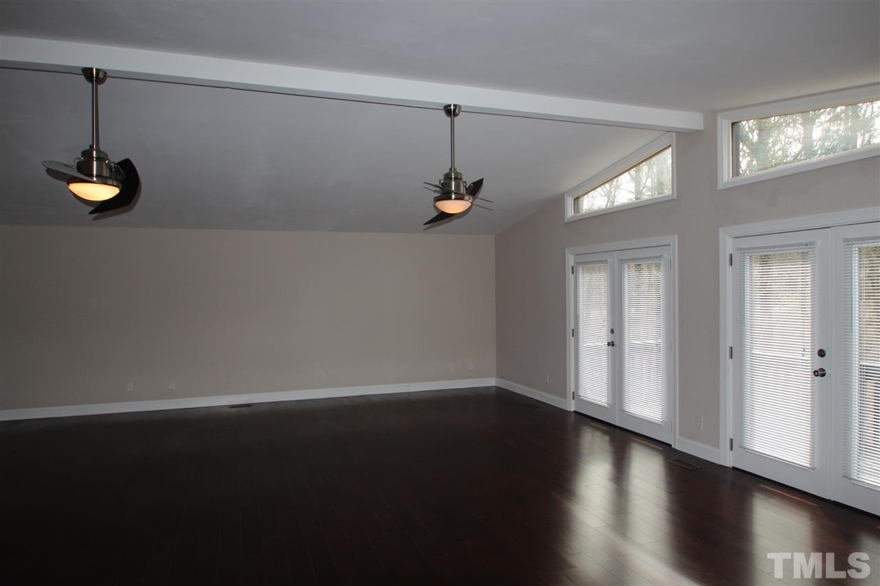 6225 Doyle Road Durham, NC 27712 - Photo 7 of 16 Large family room with fireplace and new hardwood floors Family Room