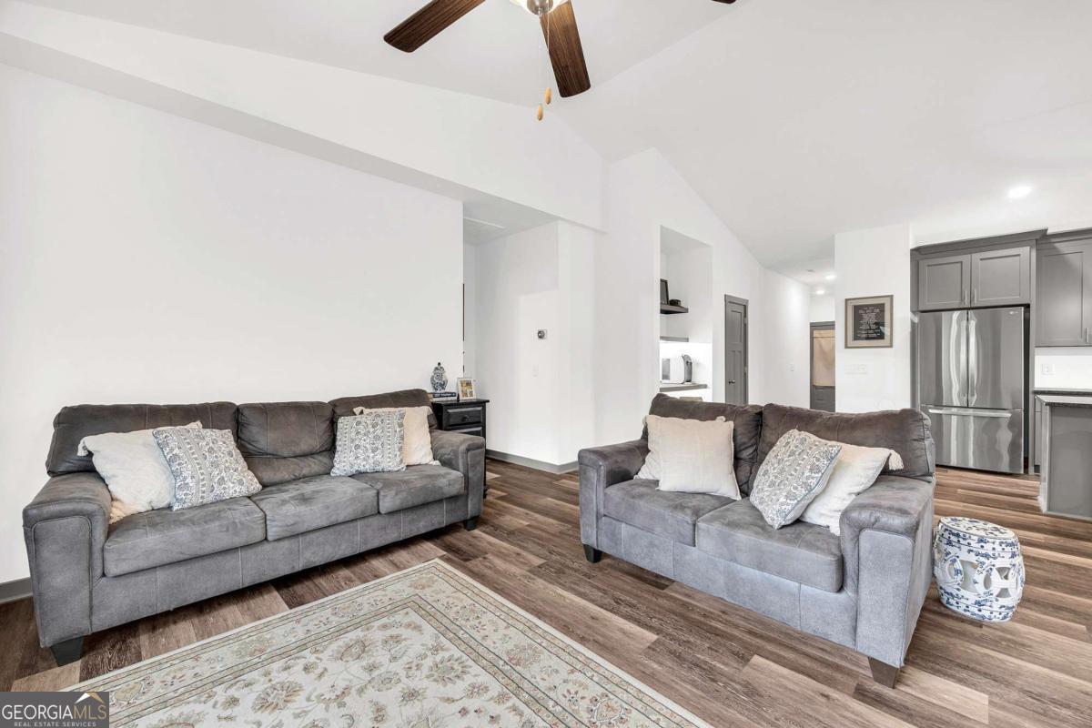 153 North Point Circle Hartwell, GA 30643 - Photo 13 of 60 a living room with furniture and a couch