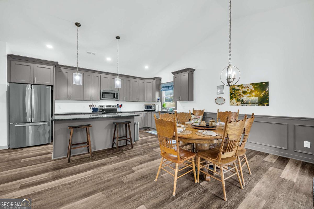 153 North Point Circle Hartwell, GA 30643 - Photo 14 of 60 a view of kitchen with refrigerator and wooden floor