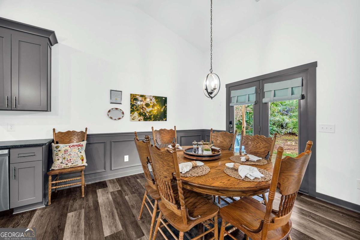 153 North Point Circle Hartwell, GA 30643 - Photo 15 of 60 a view of a dining room with furniture window and wooden floor
