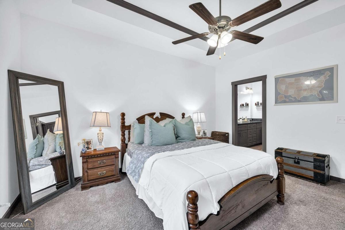 153 North Point Circle Hartwell, GA 30643 - Photo 31 of 60 a bedroom with a bed and a mirror on the dresser