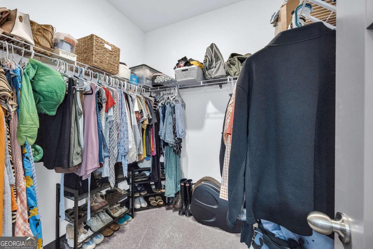 153 North Point Circle Hartwell, GA 30643 - Photo 39 of 60 a view of walk in closet with clothes and shoes