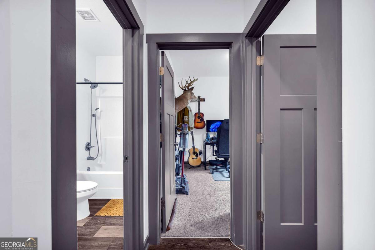 153 North Point Circle Hartwell, GA 30643 - Photo 40 of 60 a view of a hallway with a view of bedroom and bathroom