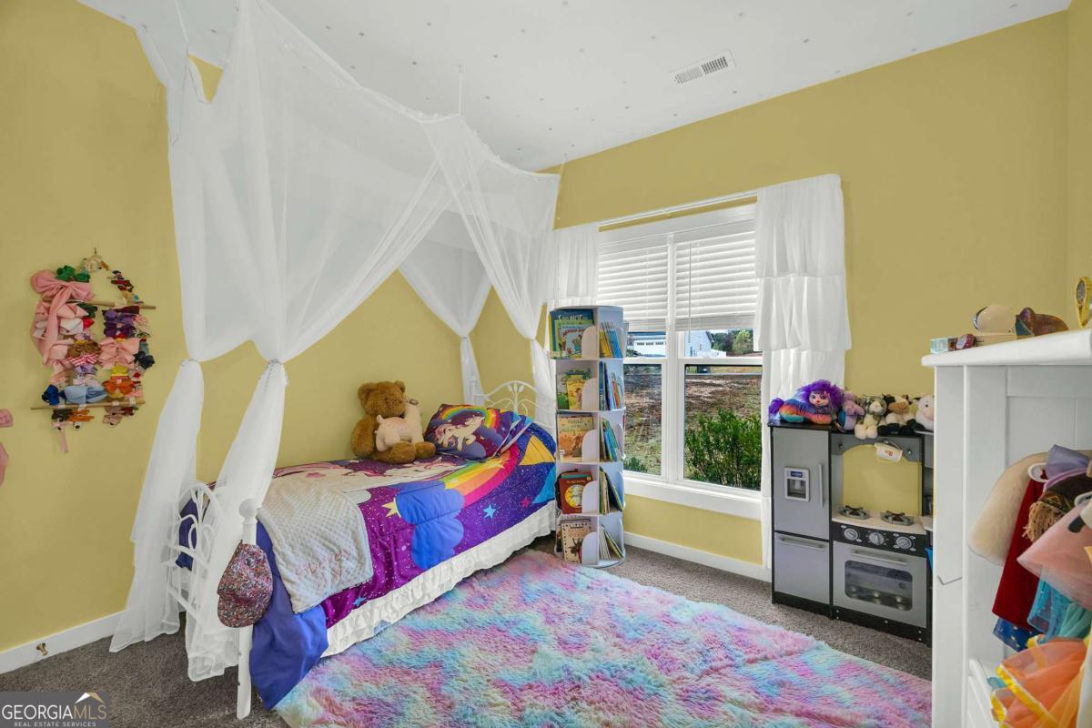 153 North Point Circle Hartwell, GA 30643 - Photo 41 of 60 a bedroom with a bed and a window