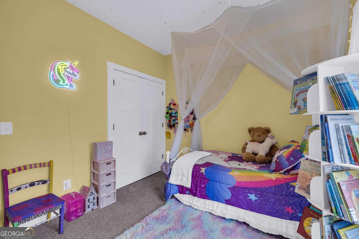 153 North Point Circle Hartwell, GA 30643 - Photo 42 of 60 a bedroom with a bed and wooden floor