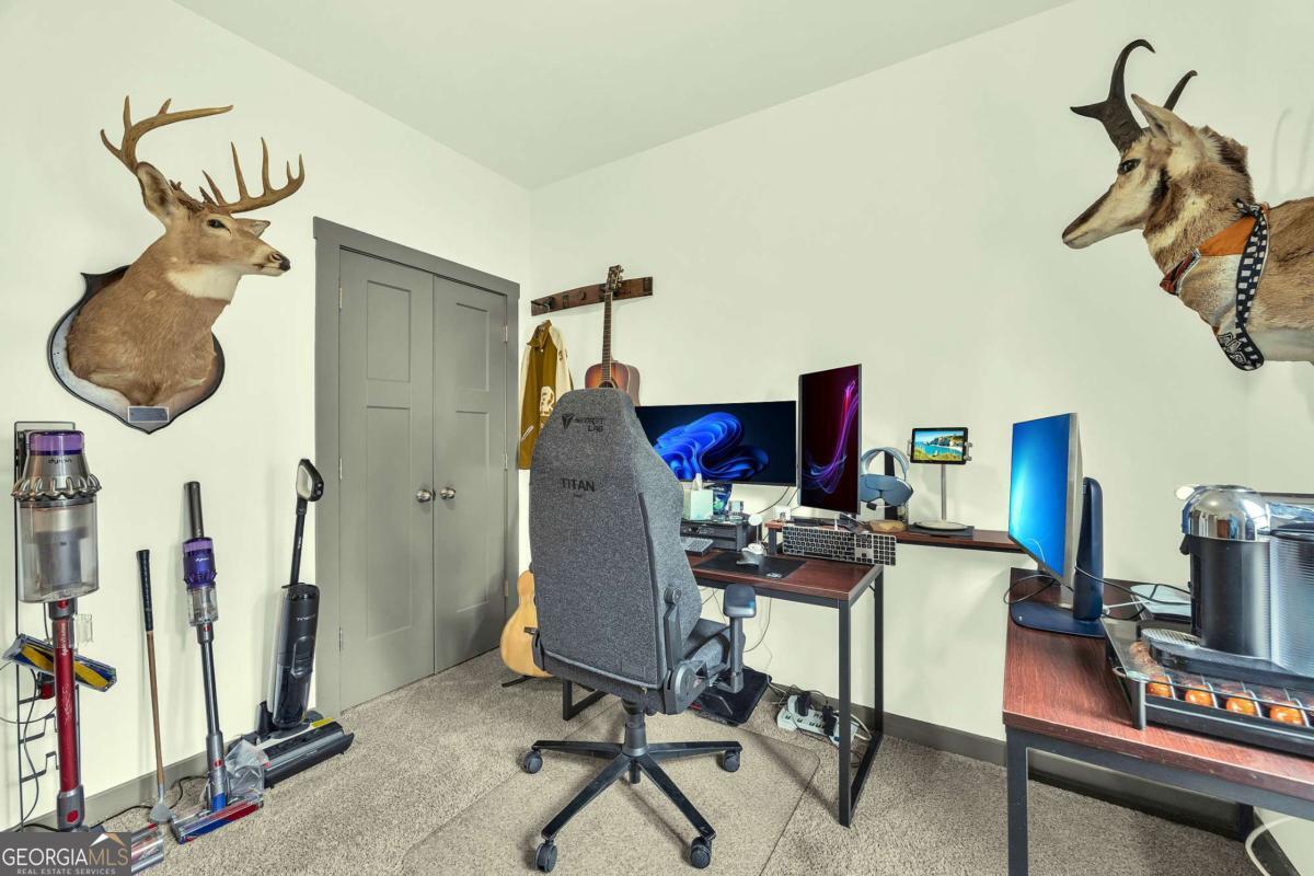 153 North Point Circle Hartwell, GA 30643 - Photo 44 of 60 a view of a workspace with furniture and a window