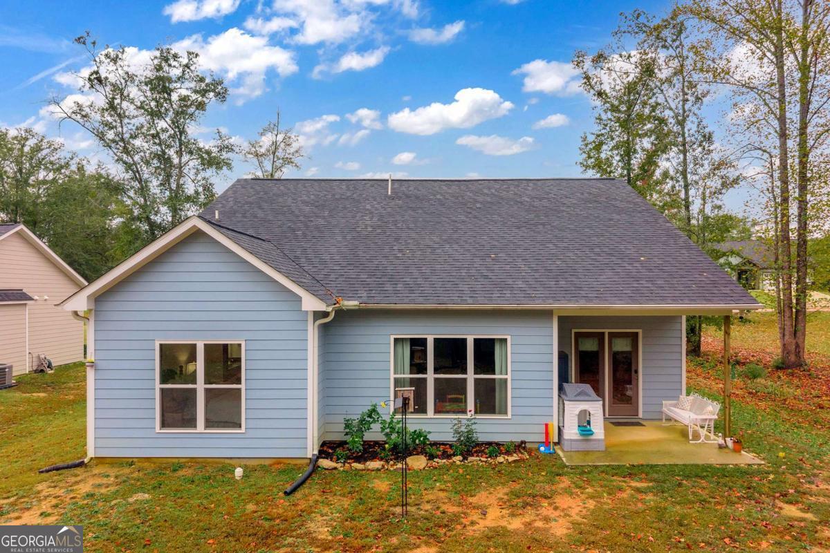 153 North Point Circle Hartwell, GA 30643 - Photo 5 of 60 a front view of a house with a yard tree and outdoor seating