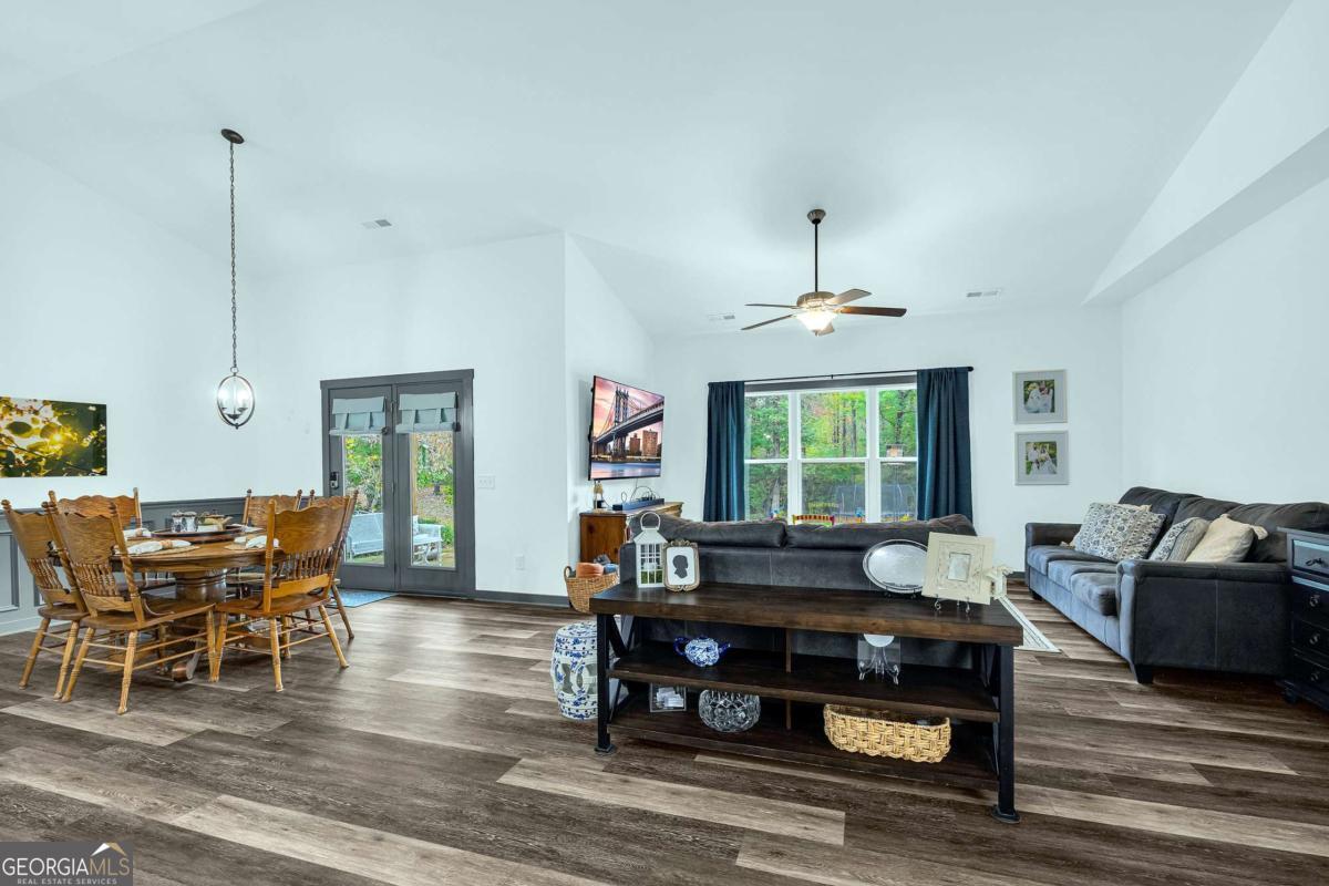 153 North Point Circle Hartwell, GA 30643 - Photo 9 of 60 a living room with furniture and a large window